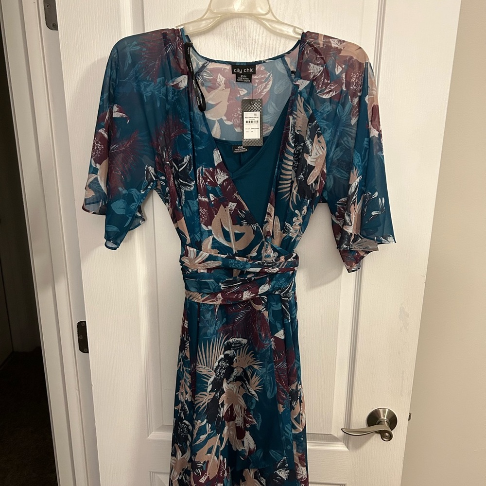 New with tags.  Dress is multicolored and sheer